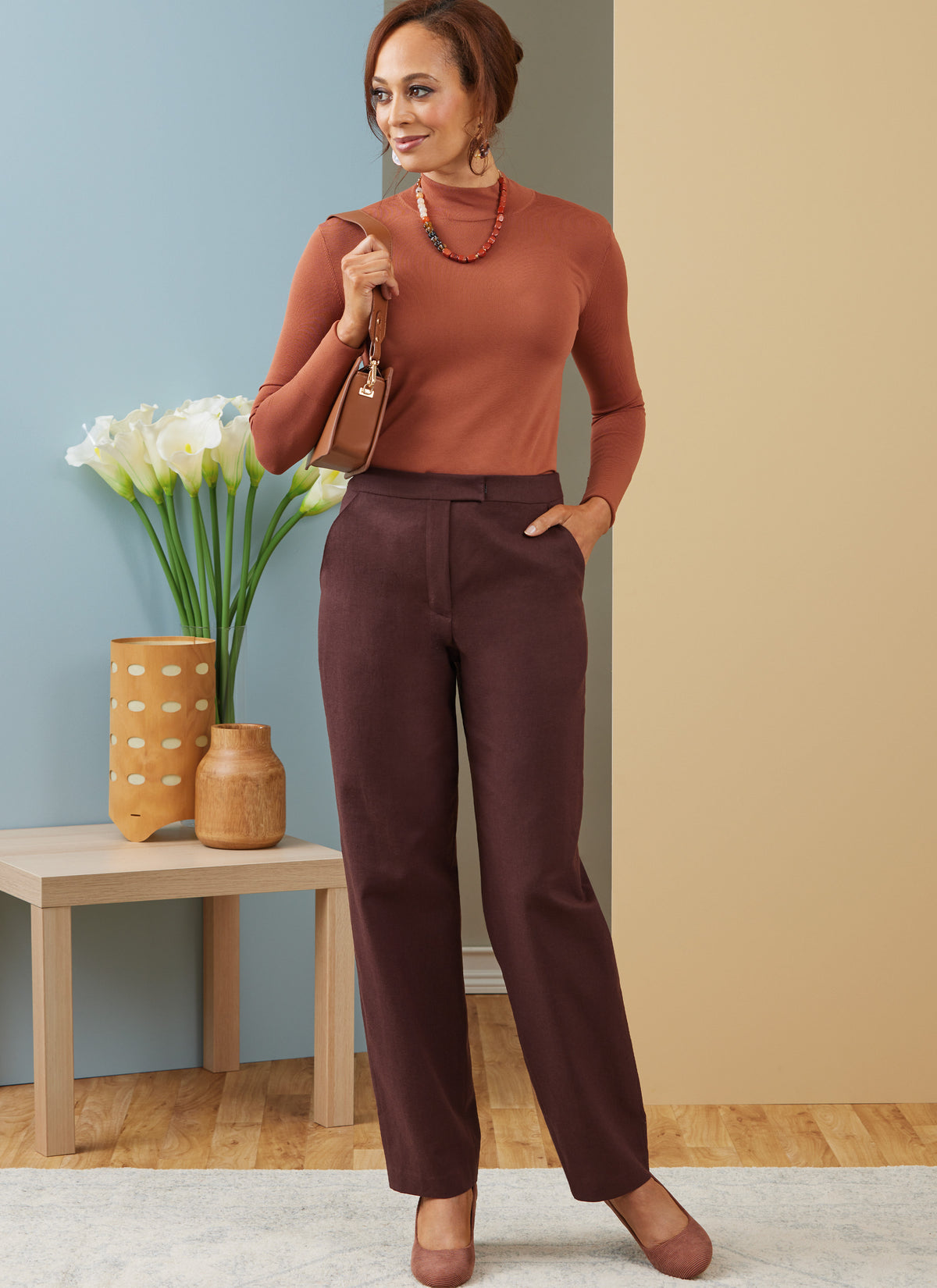 Butterick B6910 sewing pattern envelope showing the contour waist trousers designs