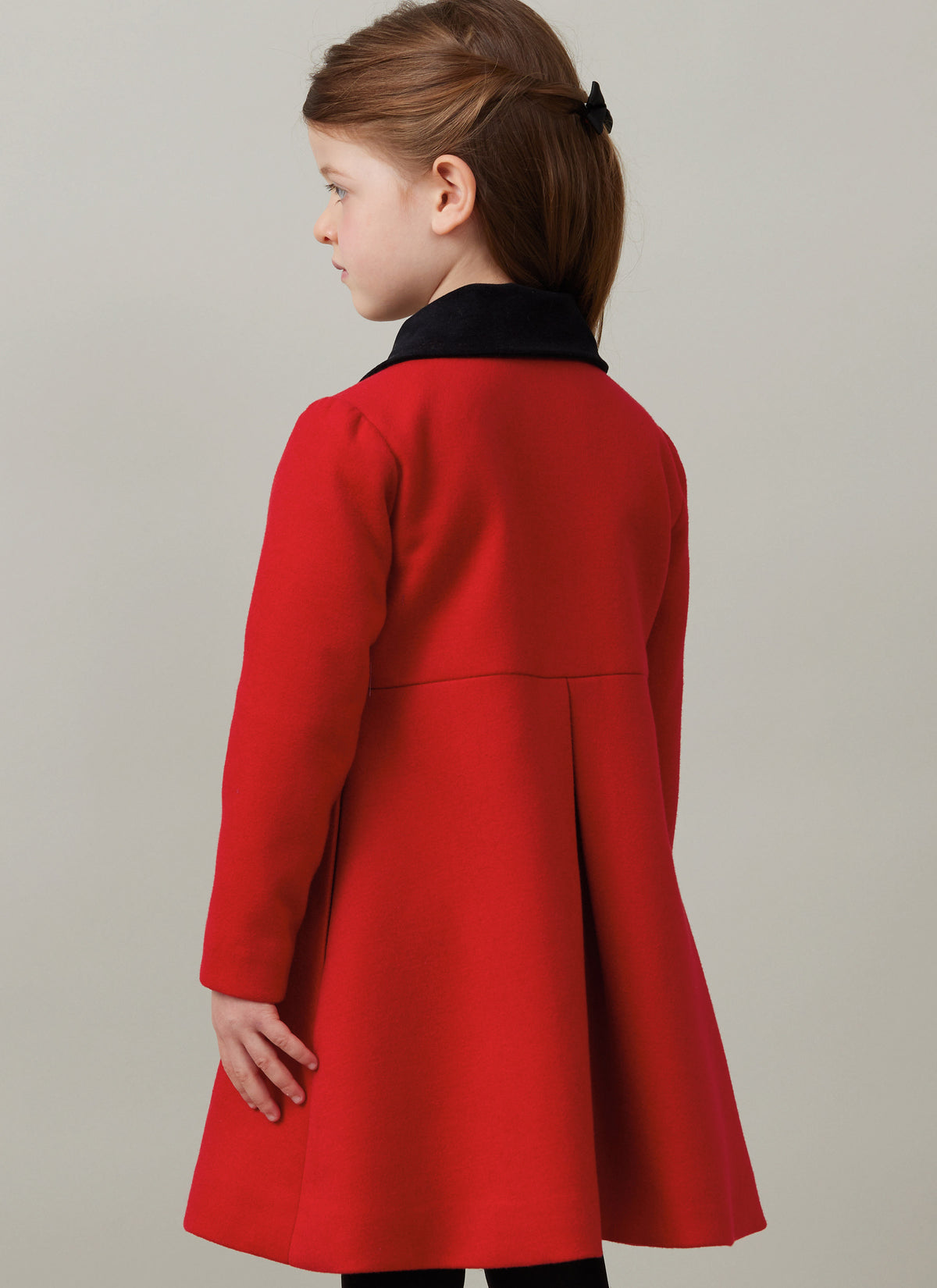 Butterick B6921 sewing pattern envelope showing the children's button front coat designs