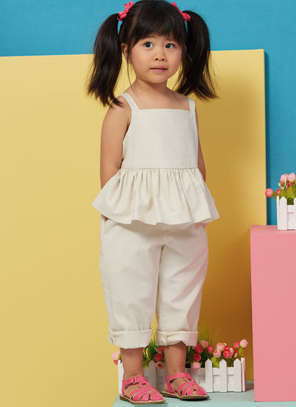 Butterick B6936 sewing pattern envelope showing the toddler overalls and dress designs