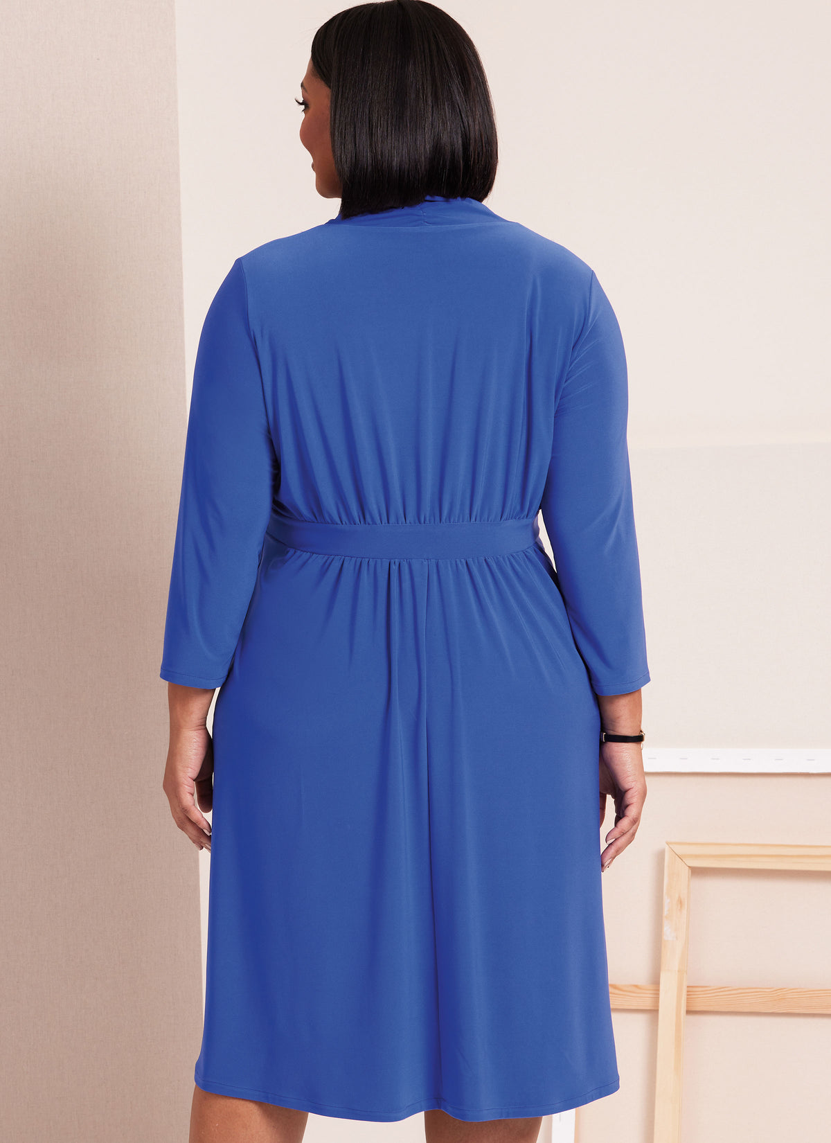 Butterick sewing pattern B6941 envelope showing a plus size knit dress in three lengths