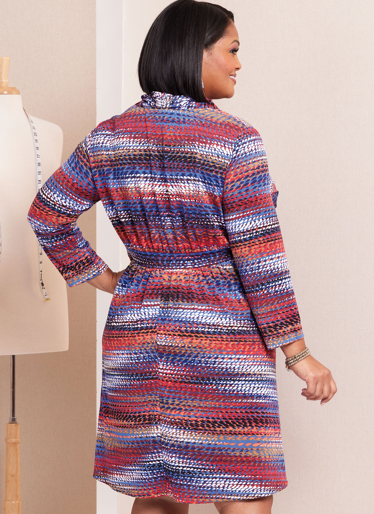 Butterick sewing pattern B6941 envelope showing a plus size knit dress in three lengths