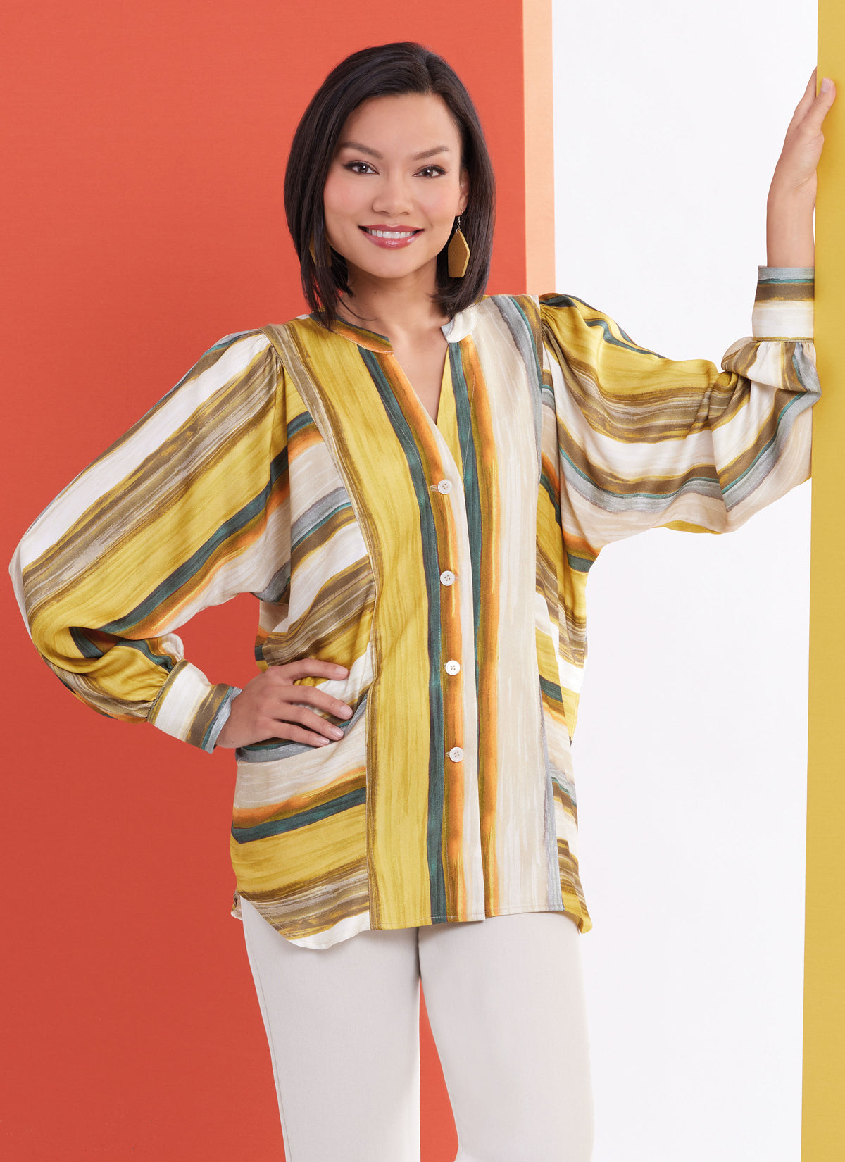 Butterick sewing pattern B6943 envelope showing a loose fitting button front top