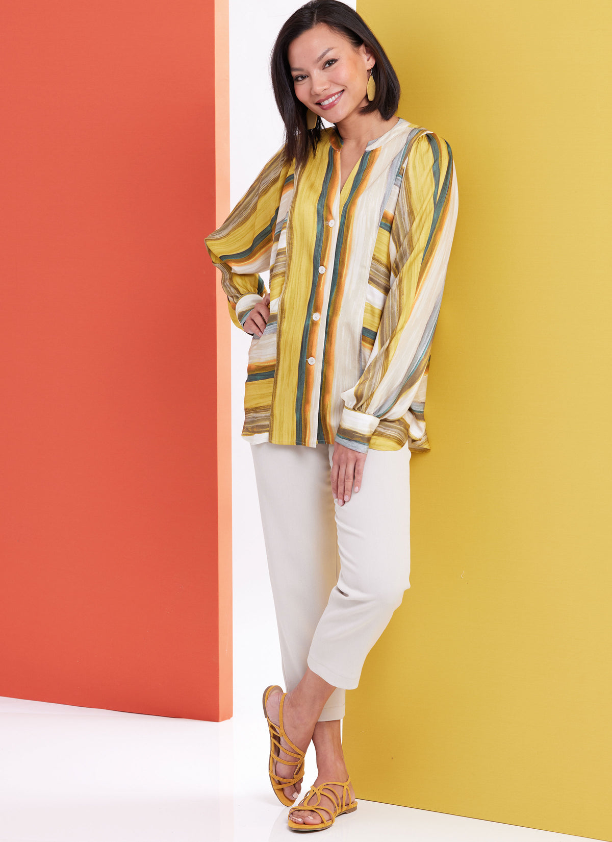 Butterick sewing pattern B6943 envelope showing a loose fitting button front top