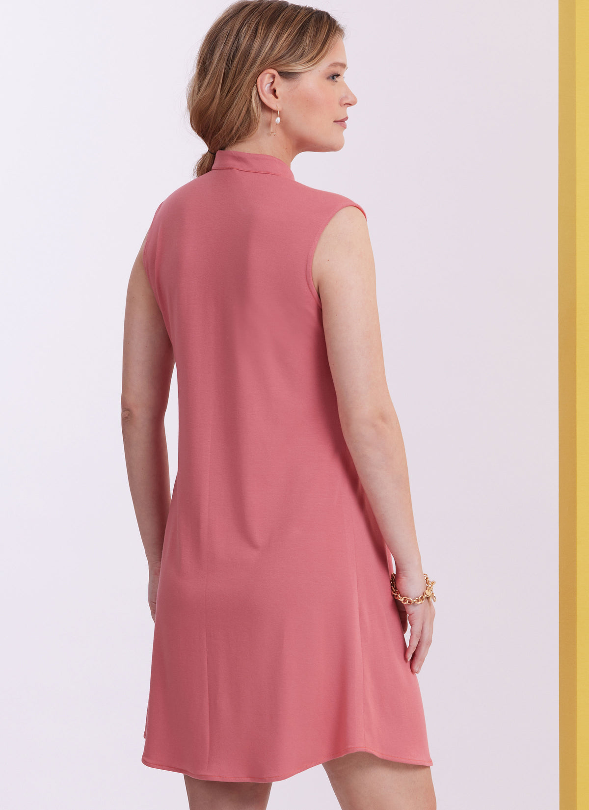 Butterick sewing pattern B6945 envelope showing a button front top or dress
