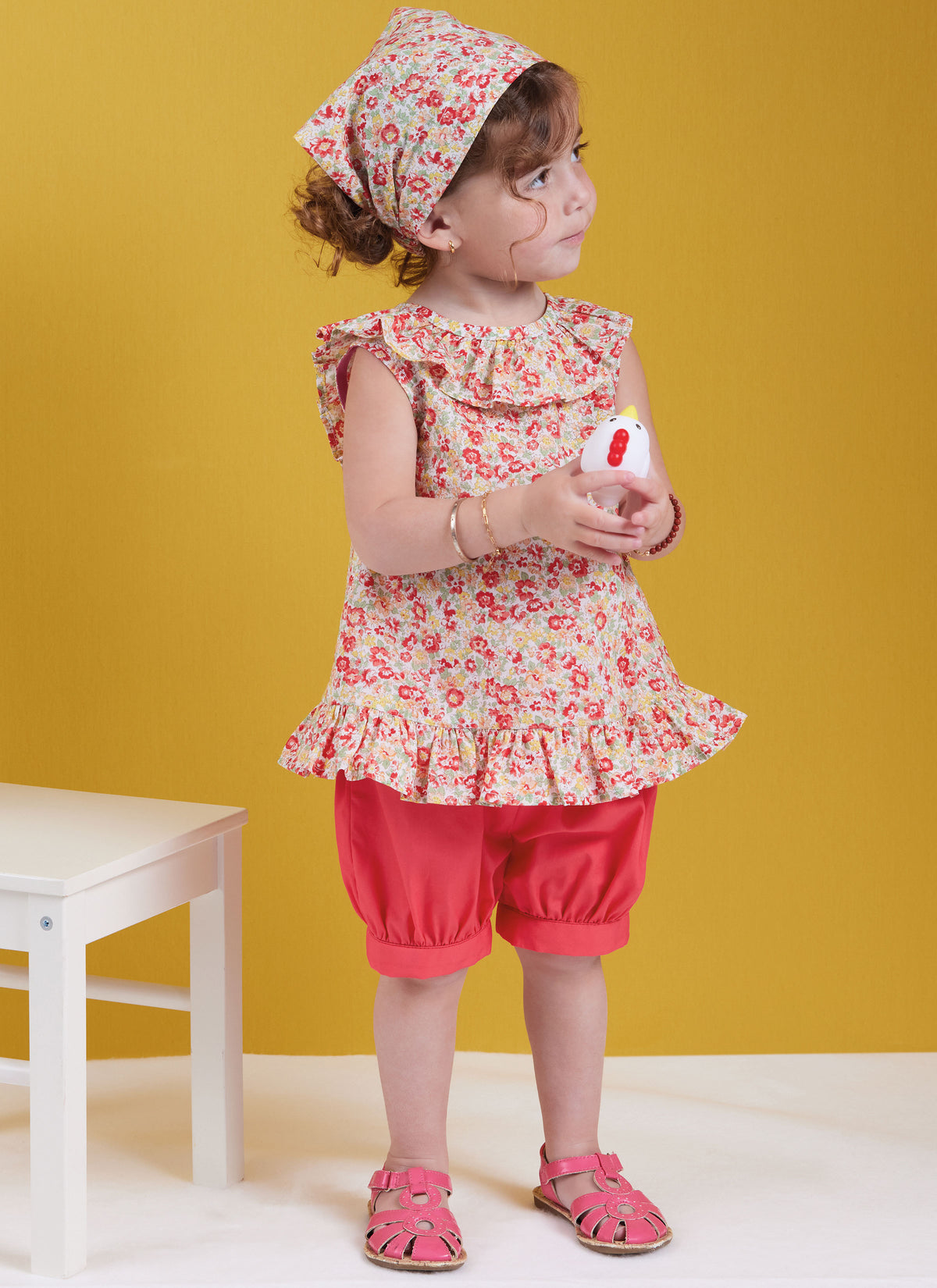 Butterick sewing pattern B6951 envelope showing a toddler's dress and top