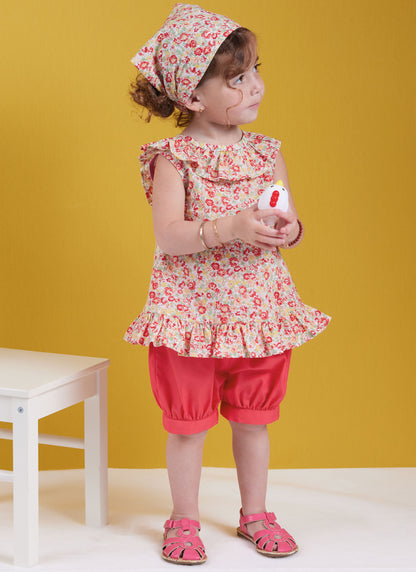Butterick sewing pattern B6951 envelope showing a toddler's dress and top