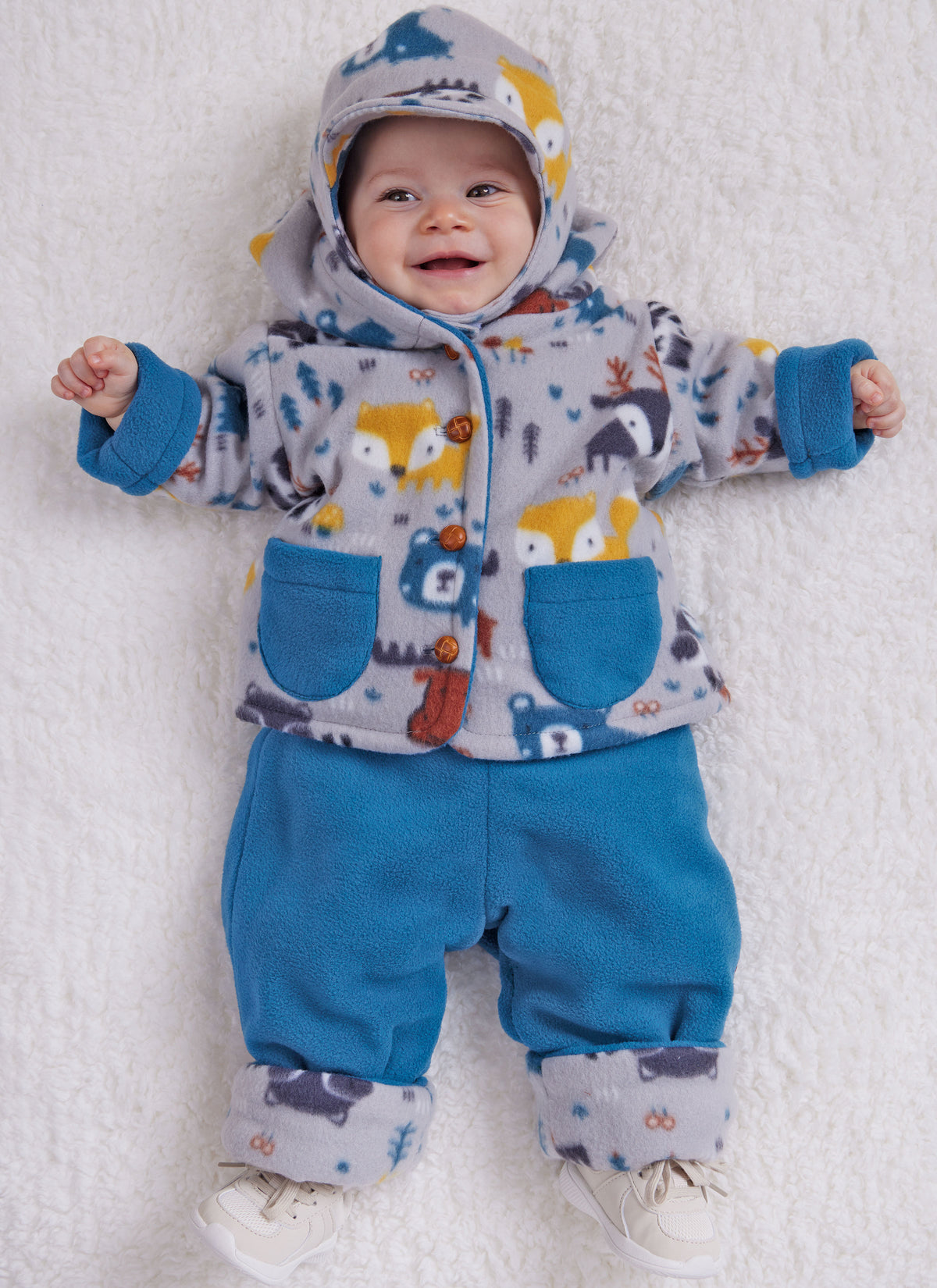 Butterick B6969 sewing pattern envelope showing a loose-fitting reversible baby jacket