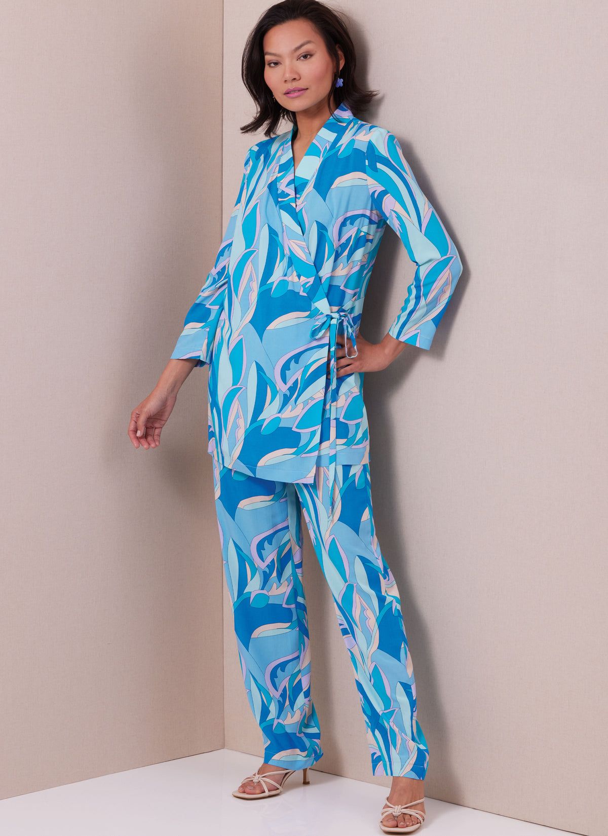 Butterick B6976 sewing pattern envelope showing a straight wrap dress and top