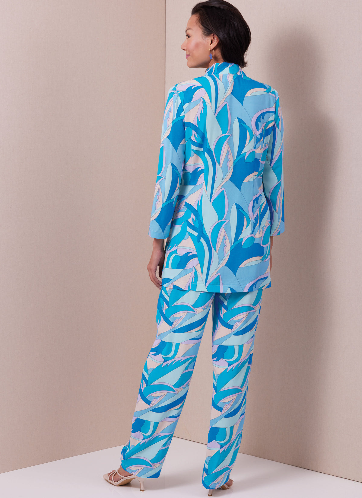 Butterick B6976 sewing pattern envelope showing a straight wrap dress and top