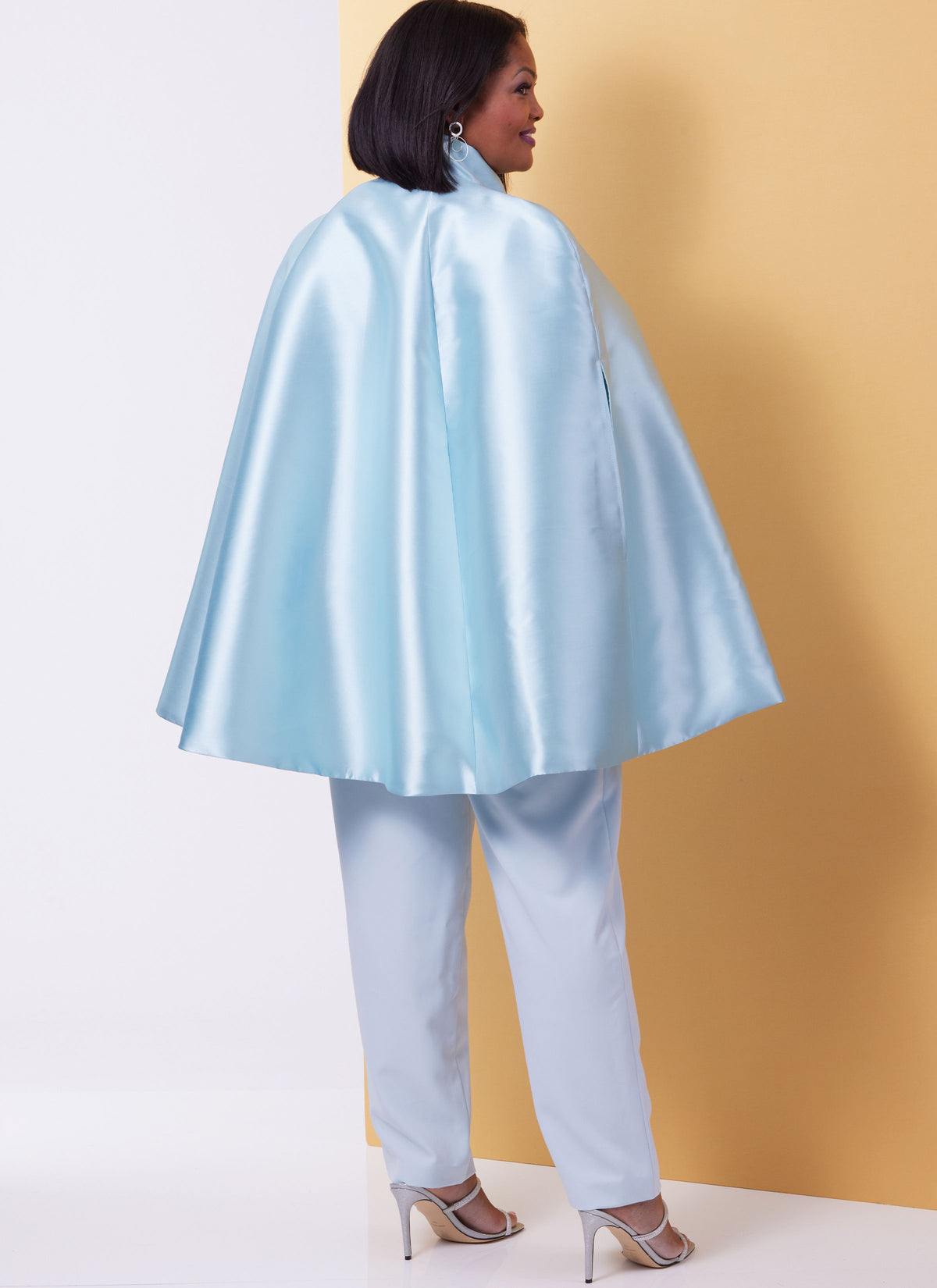 Butterick B6978 sewing pattern envelope showing lined capes