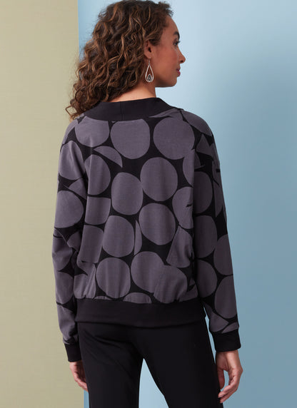 Butterick B6996 sewing pattern envelope showing crossover top designs