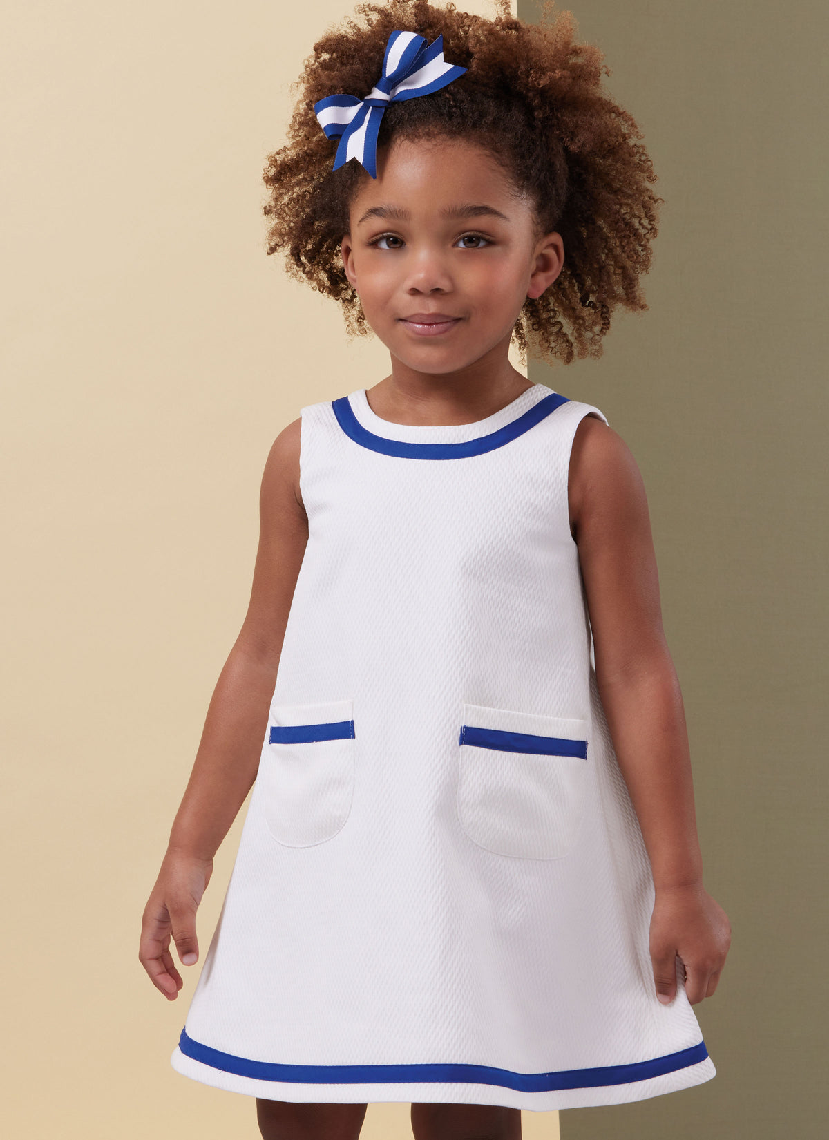 Butterick B7003 sewing pattern envelope showing toddler dress designs