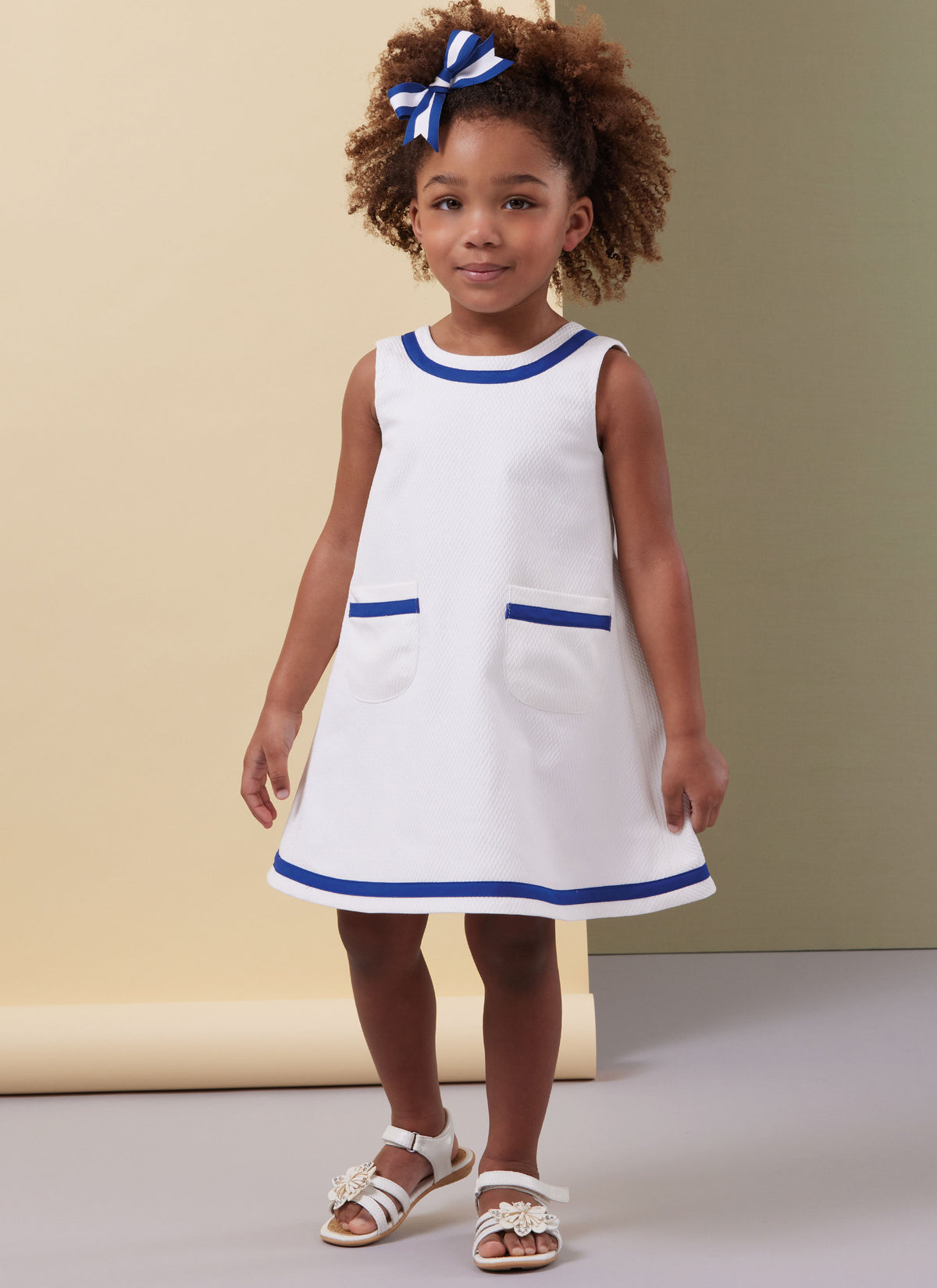 Butterick B7003 sewing pattern envelope showing toddler dress designs