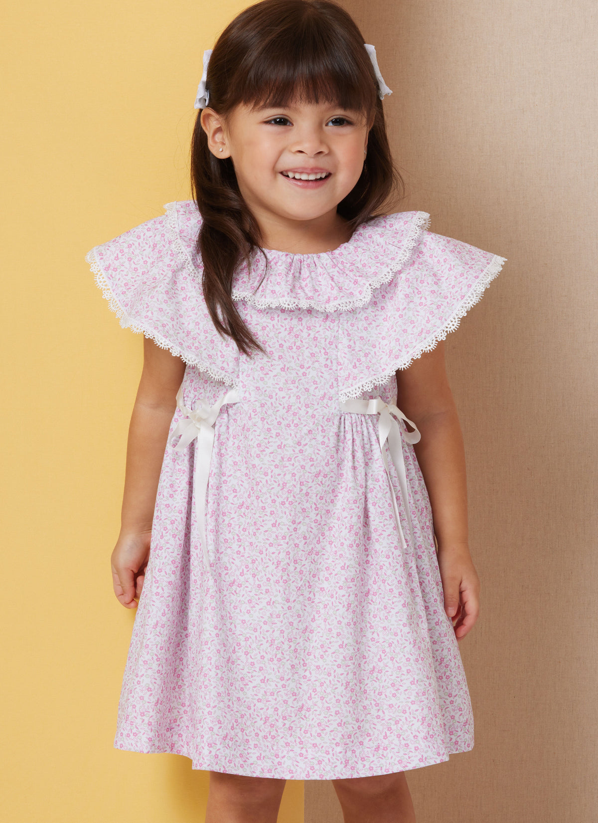 Butterick B7032 sewing pattern envelope showing toddler dress designs