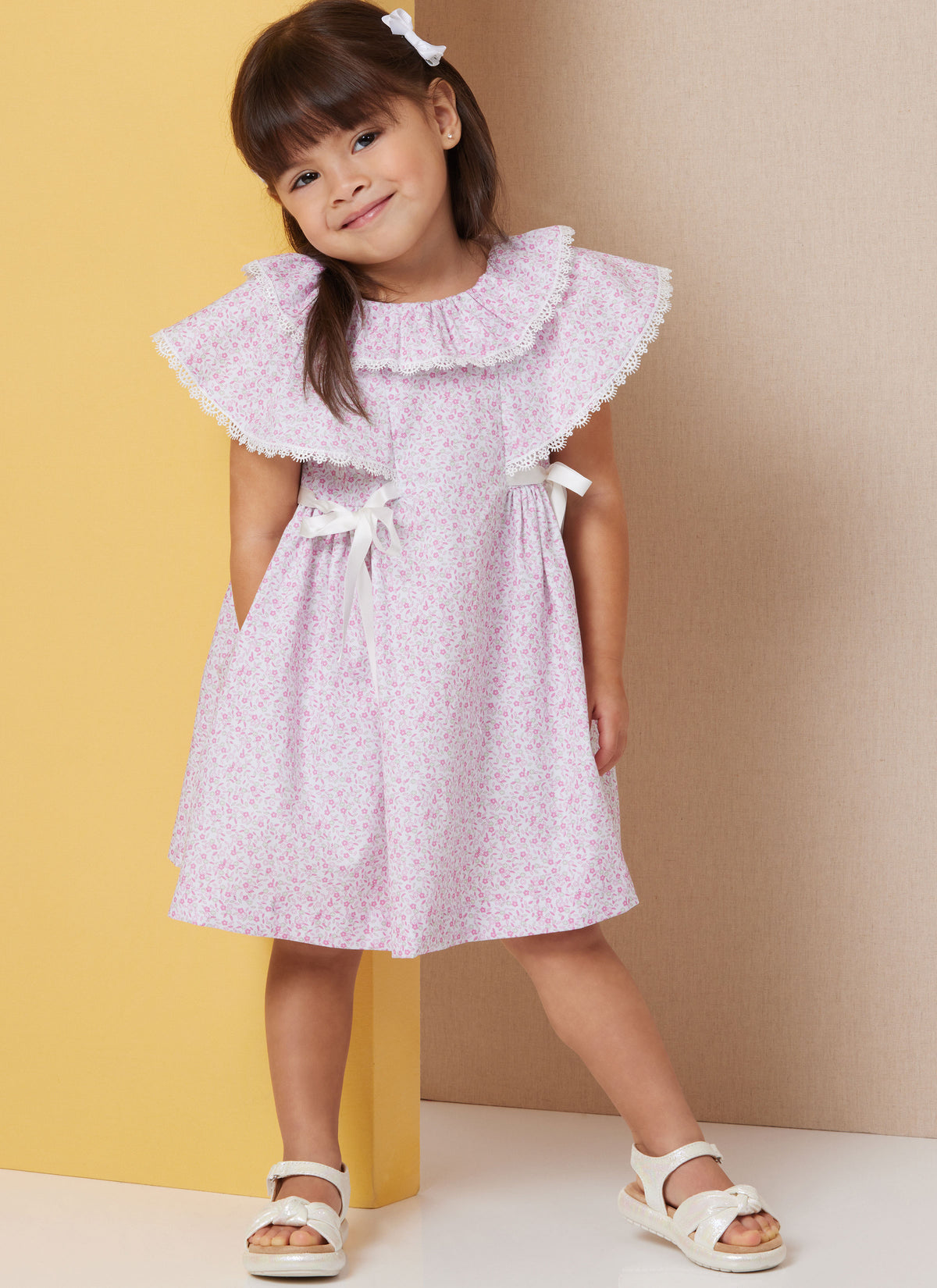 Butterick B7032 sewing pattern envelope showing toddler dress designs