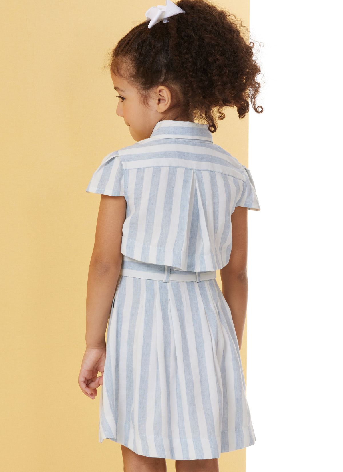 Butterick B7033 sewing pattern envelope showing child's dress designs