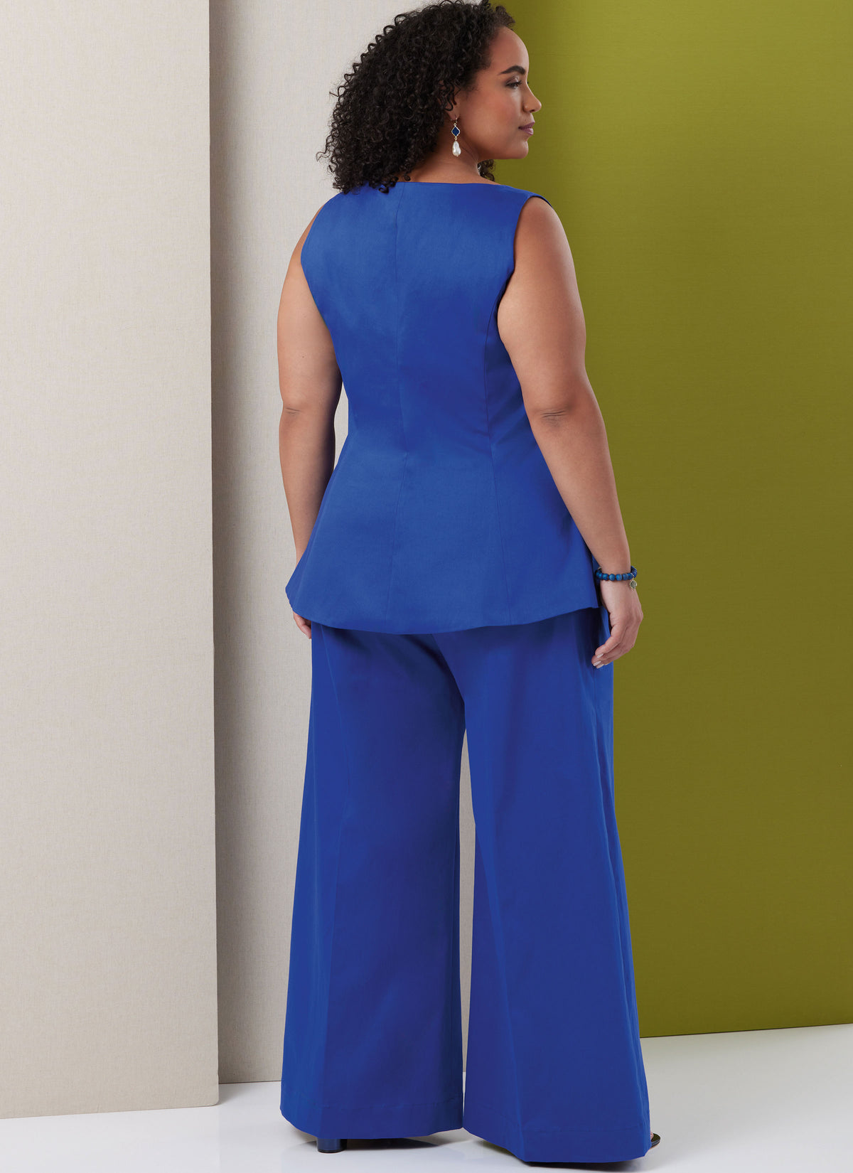 Butterick B7046 sewing pattern envelope showing sleeveless lined top designs