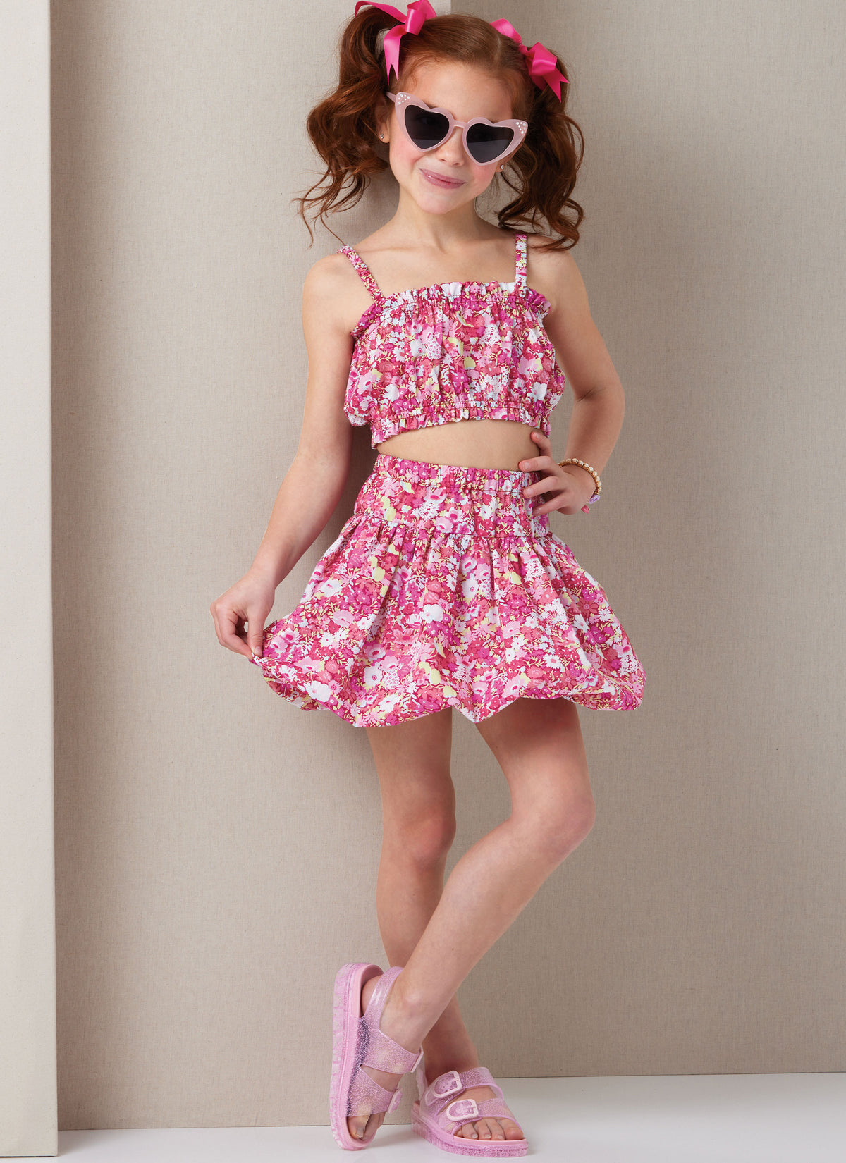 Butterick B7050 sewing pattern envelope showing children's ruffle top designs