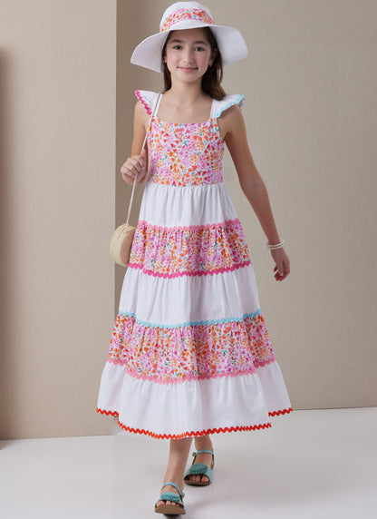 Butterick B7051 sewing pattern envelope showing girls' tiered dress designs