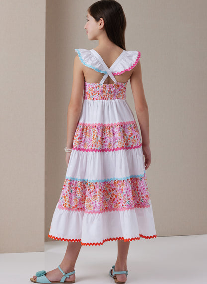 Butterick B7051 sewing pattern envelope showing girls' tiered dress designs