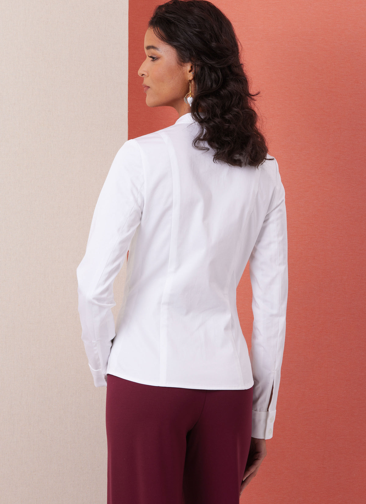 Butterick B7055 sewing pattern envelope showing fitted button-front shirt designs
