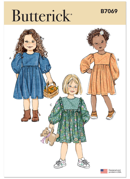 Butterick B7069 sewing pattern envelope showing a girls' dress with a full gathered skirt