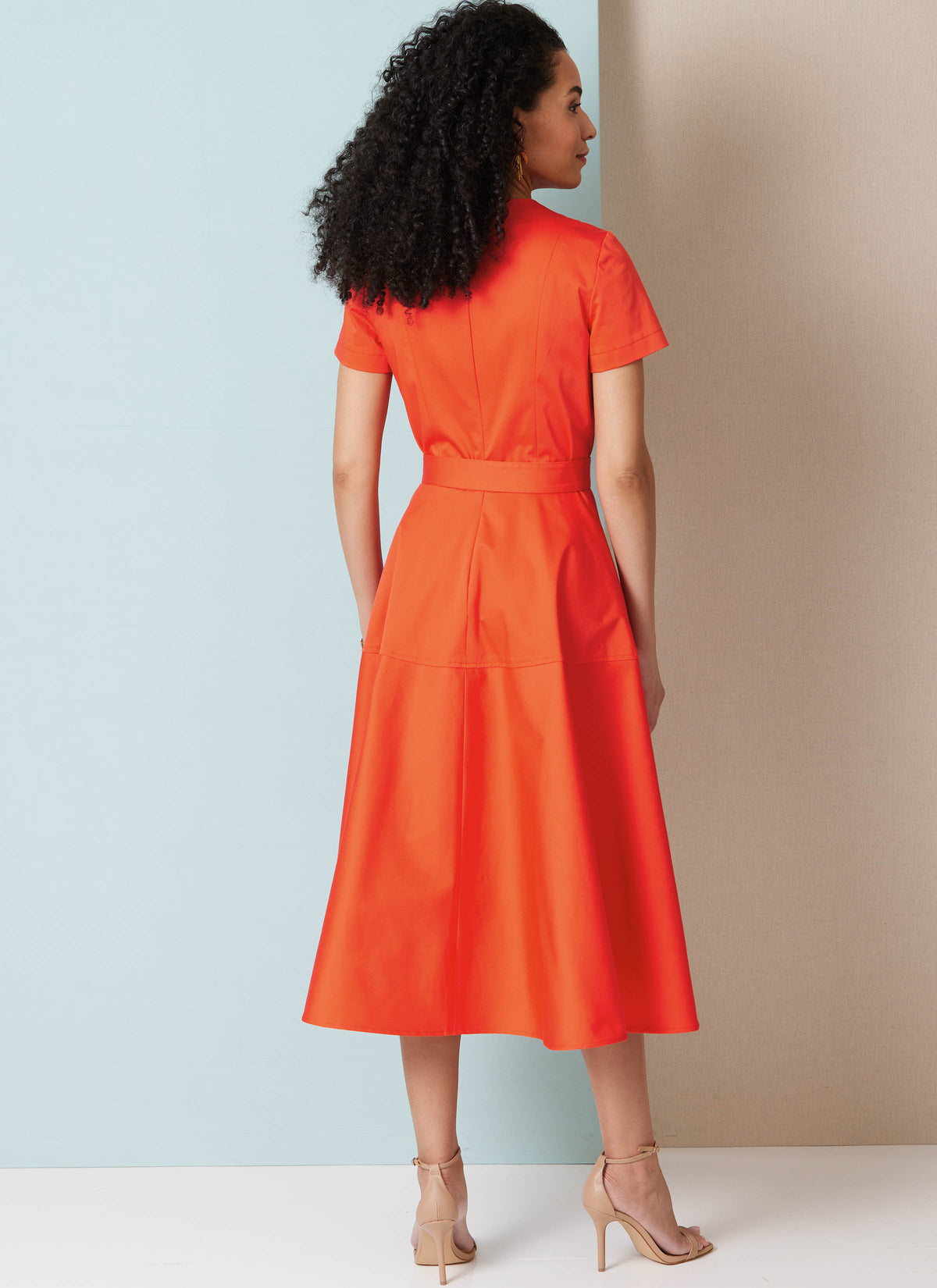 Butterick B7077 sewing pattern envelope showing a fitted dress with flared skirt
