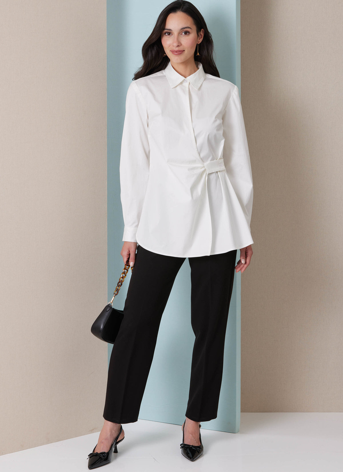 Butterick B7079 sewing pattern envelope showing a loose-fitting asymmetric wrap top