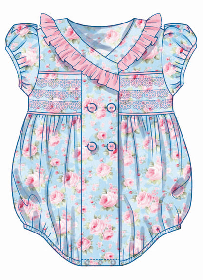 Butterick B7085 sewing pattern envelope showing a vintage-inspired double-breasted baby romper