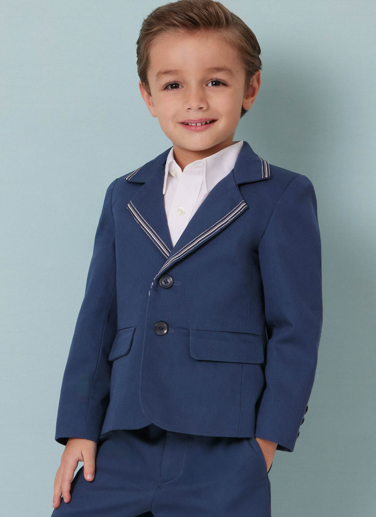 Butterick B7087 sewing pattern envelope showing a boys' lined blazer