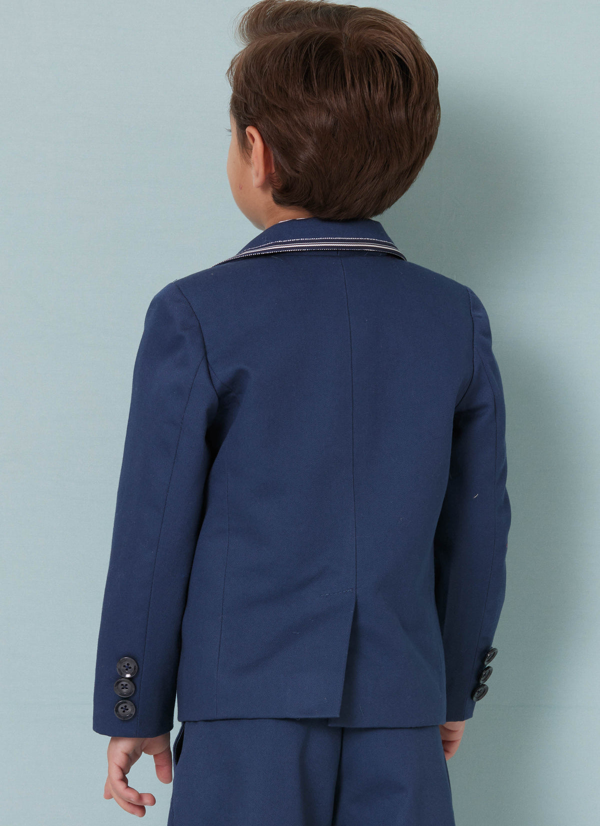 Butterick B7087 sewing pattern envelope showing a boys' lined blazer
