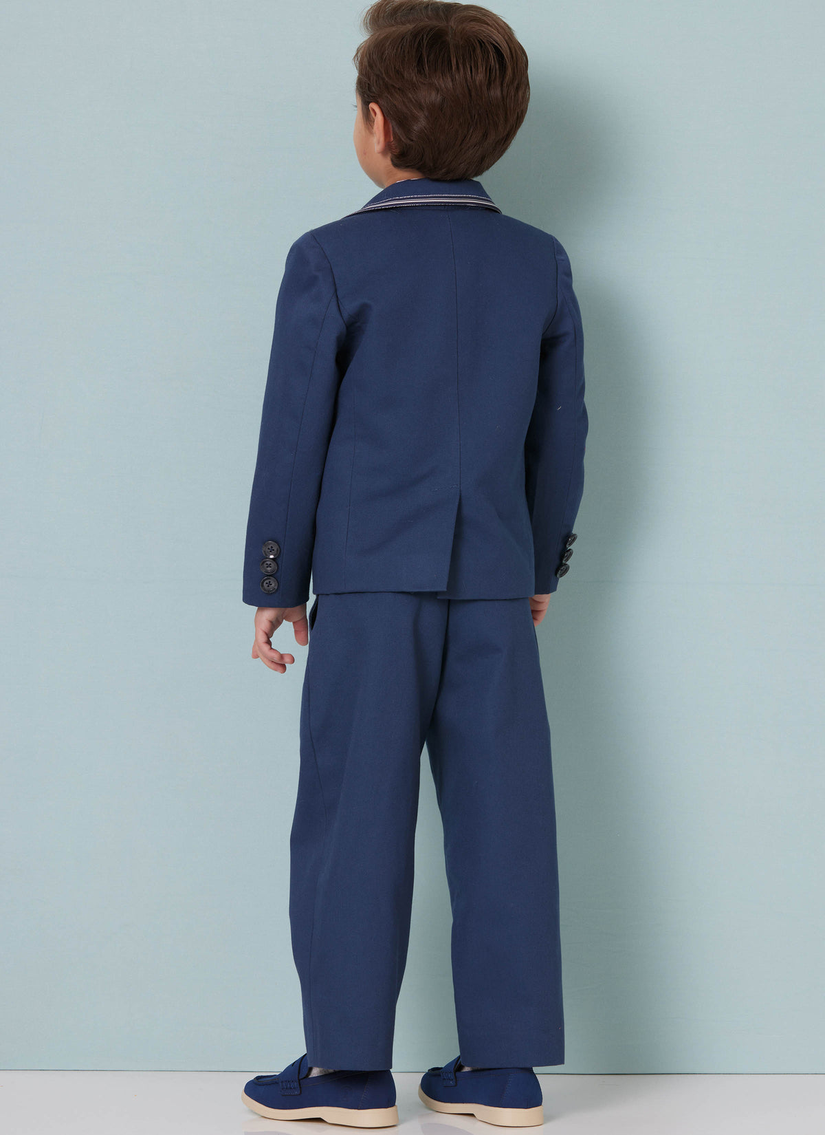 Butterick B7087 sewing pattern envelope showing a boys' lined blazer