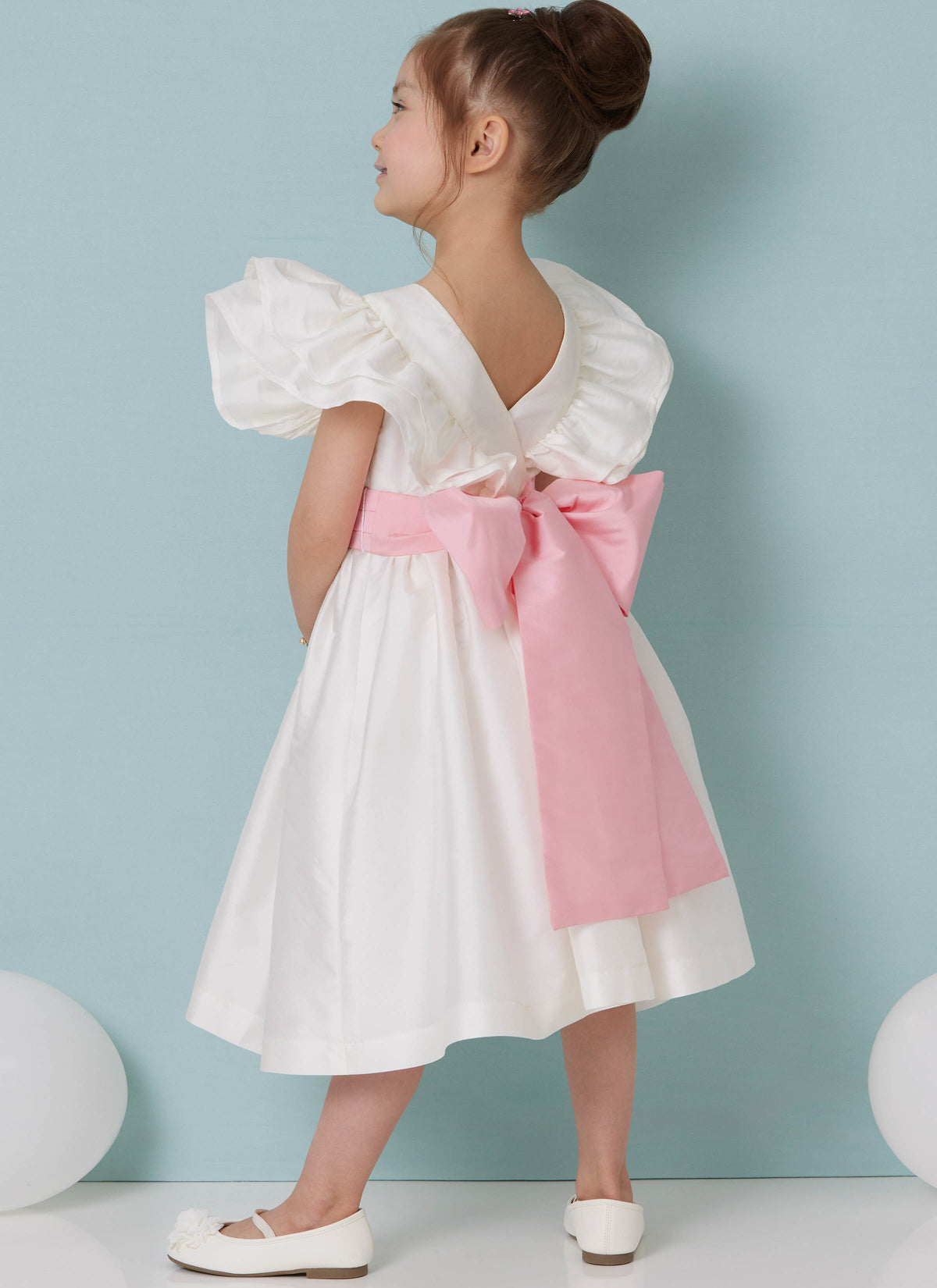 Butterick B7088 sewing pattern envelope showing a girls' dress with layered ruffle sleeves