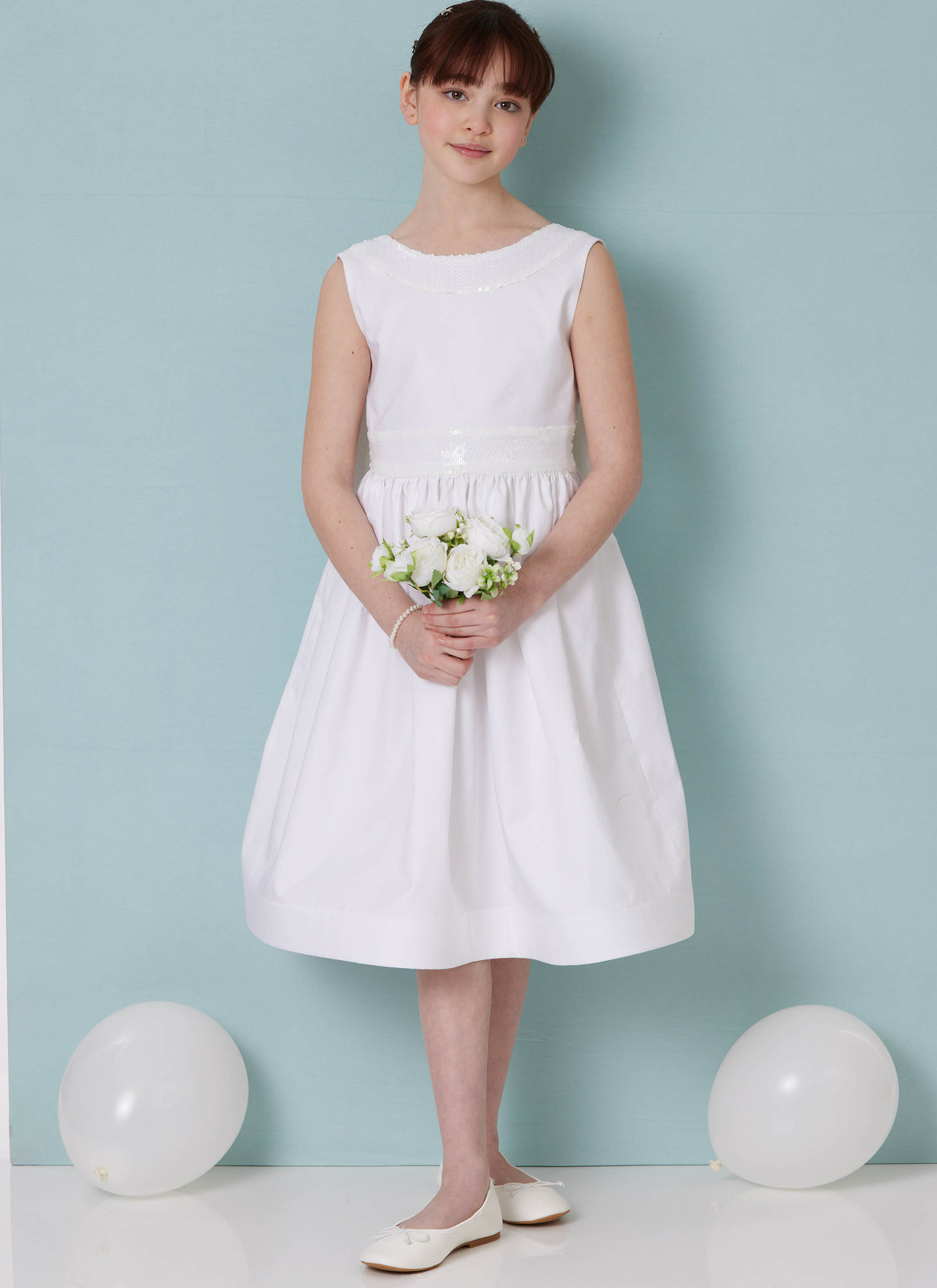 Butterick B7089 sewing pattern envelope showing a girls' lined special occasion dress with petticoat
