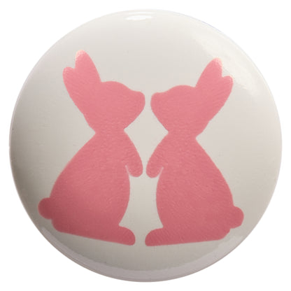 White round button printed with two pink rabbits