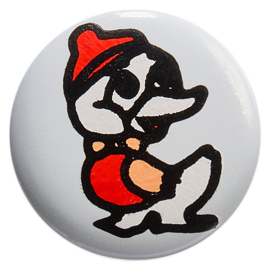 White round button printed with a cartoon duck