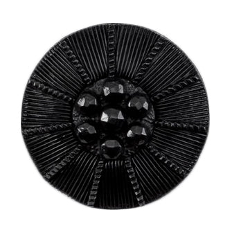Round black button with faceted centre and radiating ribbed lines