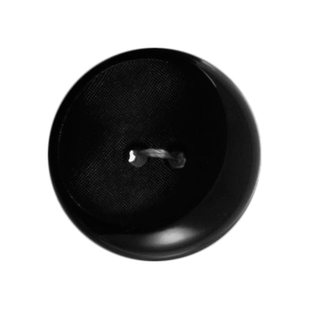 One black large shaped shiny and matt Milward 2 hole button on a card