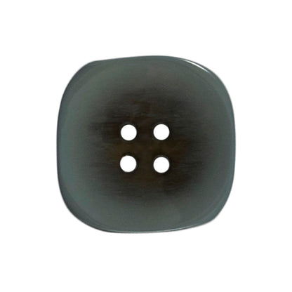 Two 22mm rounded square, two-tone teal buttons on a Milward card