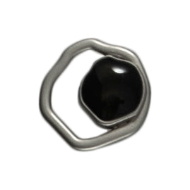 3 abstract round silver buttons, each set with an off-centre black stone on a Milward card
