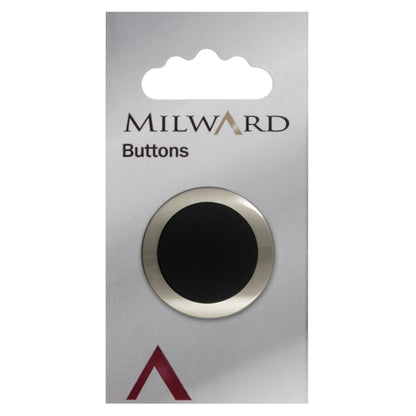 Large silver button with a curved black centre on a Milward card