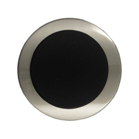 Large silver button with a curved black centre on a Milward card