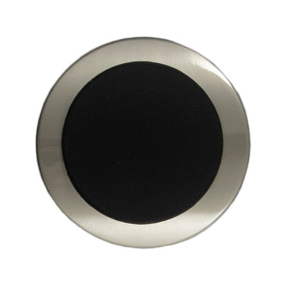 Large silver button with a curved black centre on a Milward card