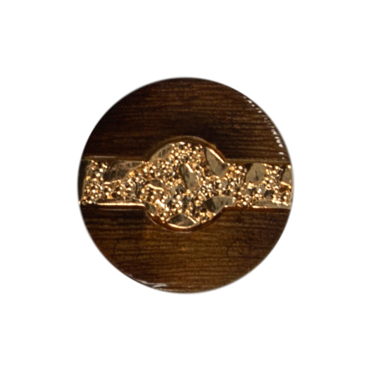 Tortoiseshell effect button with a gold strip through the centre on a Milward card