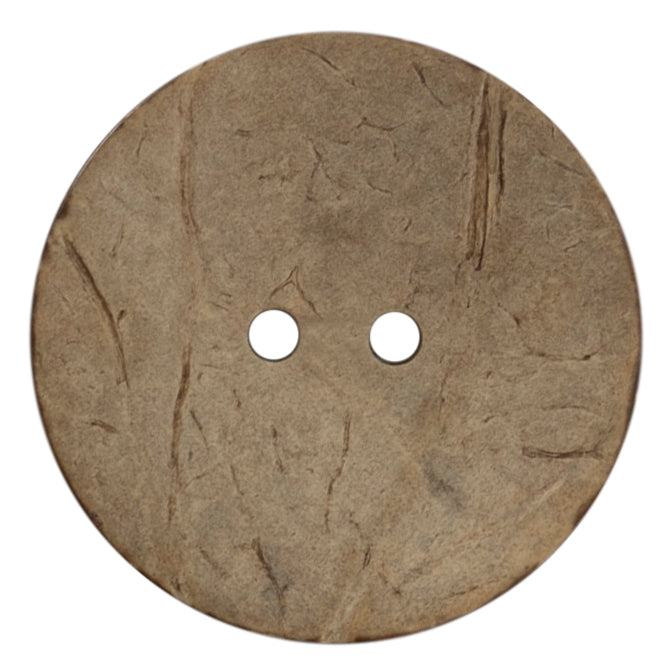 Large round coconut button on a card