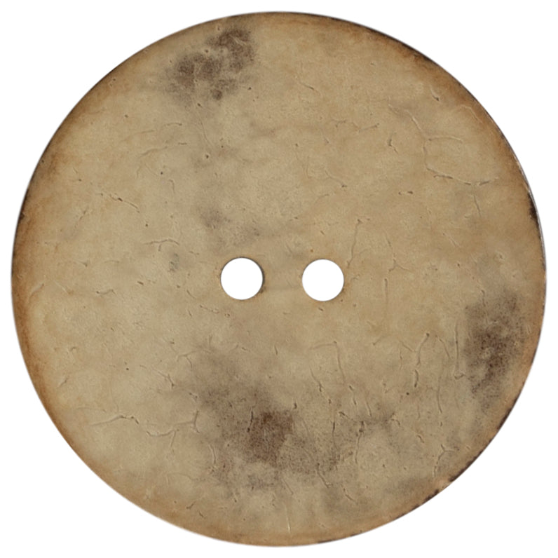 Extra large round coconut button on a card
