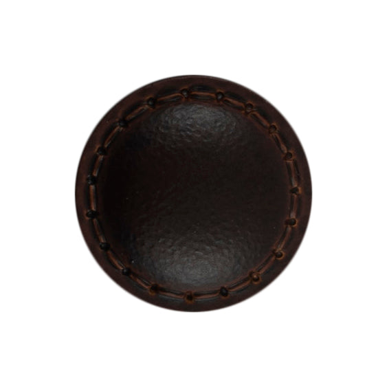Two chocolate brown imitation leather buttons with stitched rims on a Milward card