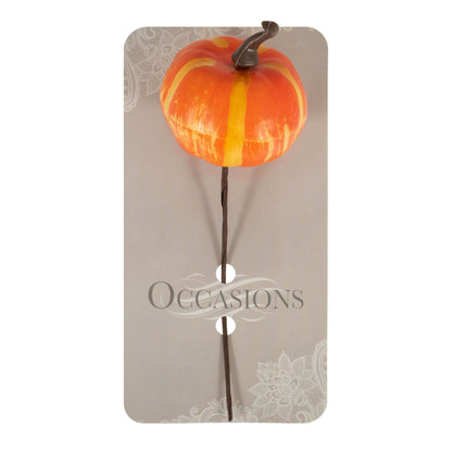 Small orange artificial pumpkin on a wire stem