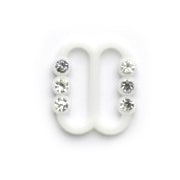 Two small white diamante strap buckles