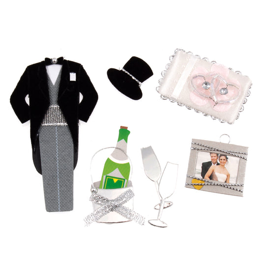 Wedding embellishments with a morning suit, top hat, champagne, glasses, rings and a photo frame